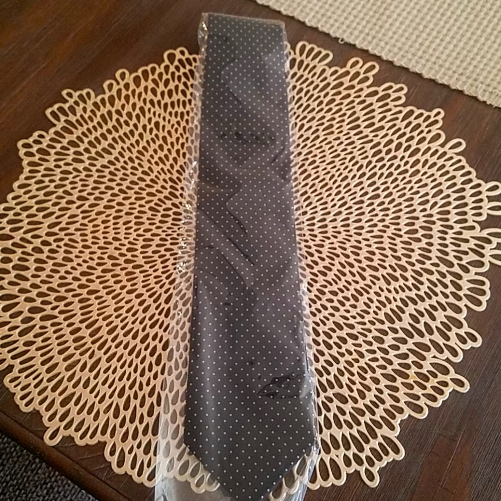 Black tie with grey polka dots